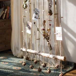 Natural birch wood wall hanging with pine cones and photo clips for rustic home decor