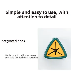 Detail of triangular adhesive towel hook with green ABS frame and yellow silicone cross slit