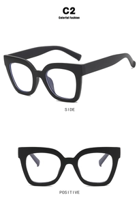 Detailed view of C2 black cat-eye glasses frame with blue light blocking lenses