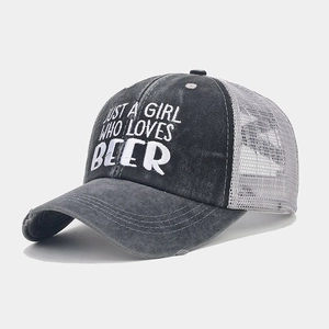 Close-up of distressed denim ponytail baseball cap with breathable mesh and embroidery