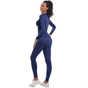 Detail of dark blue compression sportswear set showing textured rib knit fabric texture