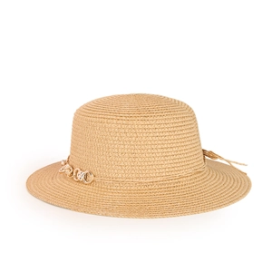 Close-up of natural straw sun hat texture featuring decorative gold metal chain link
