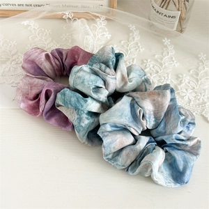 Three-piece tie-dye satin scrunchies in purple and blue silk fabric for women's hair