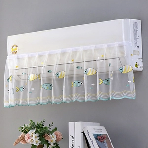 Close-up of white lace air conditioner cover with tropical fish embroidery and wavy edges