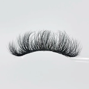 Dramatic 20mm faux mink eyelashes with dense volume and messy layered Russian curl style