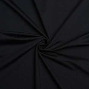 Close-up of black knitted fabric texture showing high elasticity and soft finish