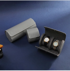 Gray leather cylindrical watch storage boxes in single and triple slot sizes