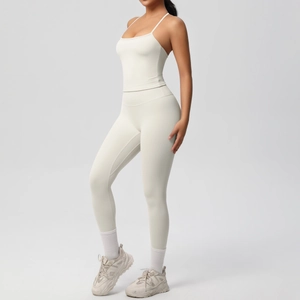Side view of cream high-waist yoga set featuring slim strap tank top and leggings