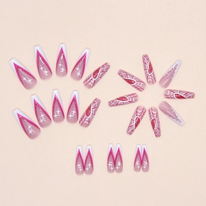 Long coffin nails featuring pink spider web patterns and glitter heart details