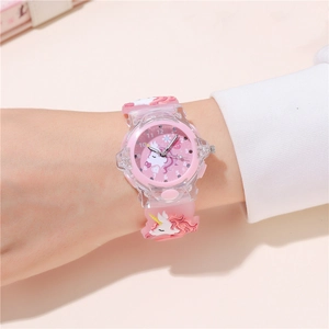 Macro view of pink unicorn kids watch with flexible silicone strap and luminous LED light