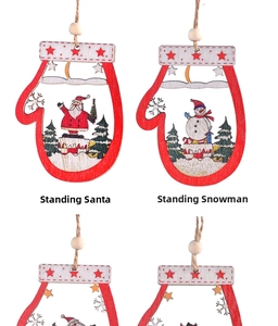 Detailed view of wooden glove-shaped Christmas ornaments with Santa and snowman motifs