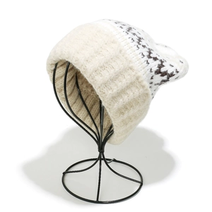 Detail of bohemian geometric knit pattern and ribbed cuff on a winter beanie hat