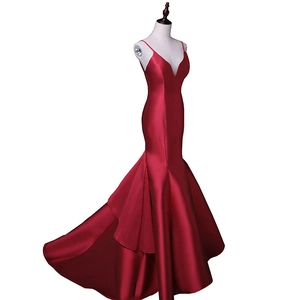 Elegant burgundy satin mermaid evening dress with thin straps and a long flowing train
