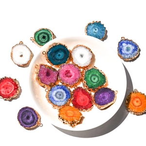 Natural agate slice sunflower pendants with gold plated edges in various vibrant colors