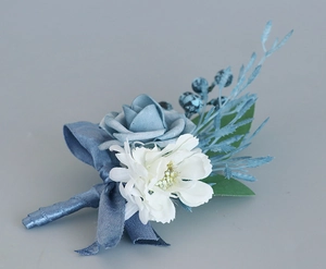 Detail of blue and white wedding boutonniere with silk roses and berry accents