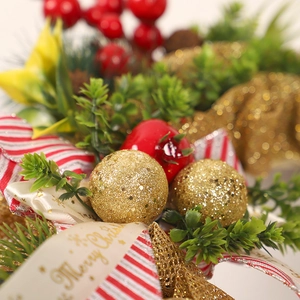 Christmas wreath with plaid ribbons, red berries and gold glitter balls for door decor