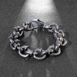 Macro shot of punk style stainless steel nail bracelet with vintage silver finish