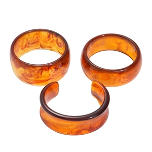 Three-piece geometric resin bangle set with amber tortoiseshell marble texture in brown