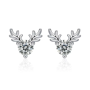 Macro detail of silver reindeer antler stud earrings with a bright round zircon stone