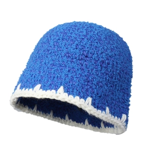 Retro hand-crocheted royal blue knit beanie with white trim, winter warm wool hat
