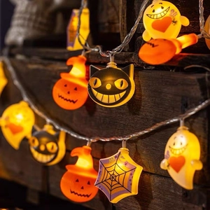 Halloween LED string lights featuring wizard pumpkins, black cats, and ghosts on dark wood