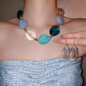 Acrylic chunky oval bead necklace and earring set in blue and green tones