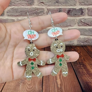 Festive gingerbread man acrylic earrings with gold glitter and Oh Snap message design