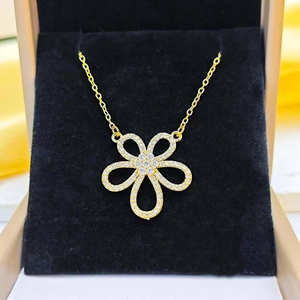 Elegant gold titanium necklace with hollow flower pendant and white crystal accents