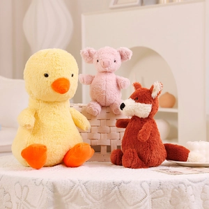 Plush animal dolls featuring a yellow duck, pink pig, and red fox in a cozy home setting