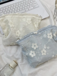Lace floral embroidery cosmetic bag set in cream and blue with a top zipper closure