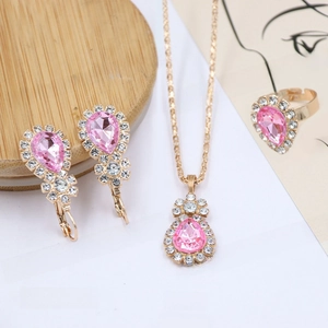 Detail of pink pear-cut gemstone jewelry set with necklace, ring and stud earrings