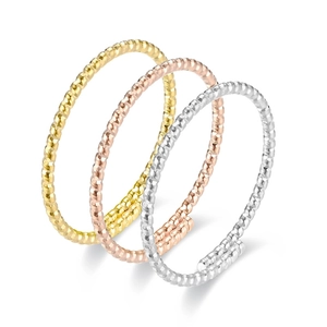Three-piece stackable twisted cable rings set in gold, rose gold and silver finishes