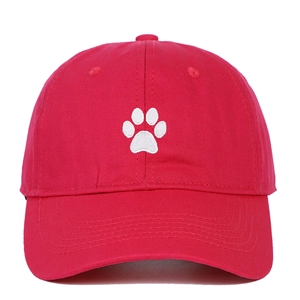 Red cotton baseball cap featuring white paw print embroidery in a six-panel design