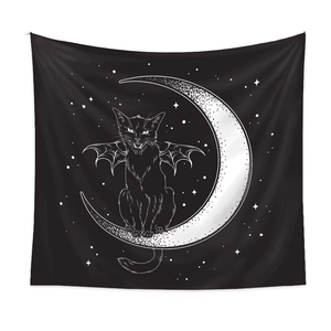 Detail of gothic tapestry featuring a black cat with bat wings on a crescent moon