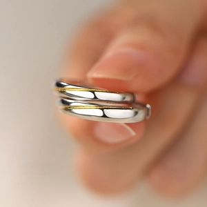 Minimalist S925 sterling silver couple rings with gold line detail and polished finish