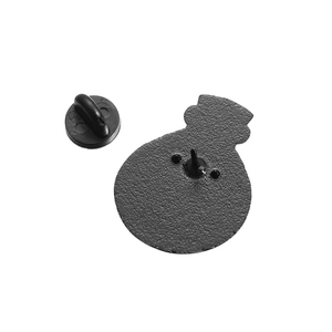 Detail view of the black matte metal brooch back with secure rubber butterfly clutch