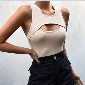 Detail of beige ribbed knit bodysuit with cutout chest design and sleek U-neckline