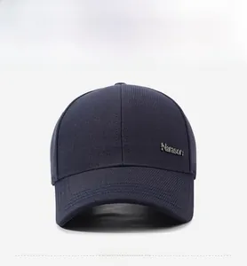 Detail of navy blue twill cotton baseball cap with metallic Narason brand logo plate