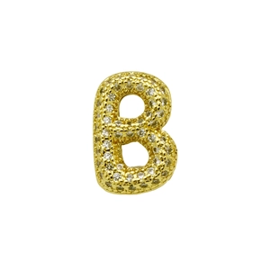Macro shot of 3D gold-plated letter B charm pavé-set with sparkling white zircons