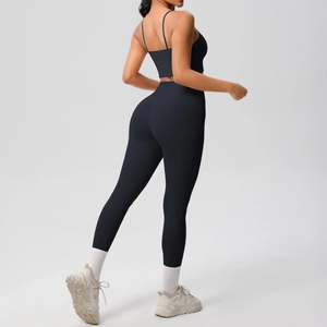 Close-up of black yoga set featuring thin strap back design and high waist leggings