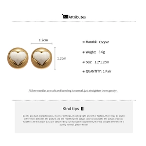 Detail view of copper heart stud earrings with silver needles and size dimensions