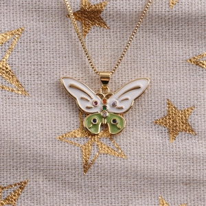 Colorful butterfly pendant necklace with enamel wings and gems on a gold box chain