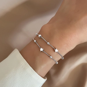 Minimalist double layer silver star and bead bracelet set for women worn on wrist