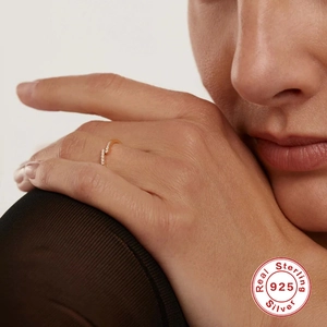 Elegant S925 sterling silver bypass ring with sparkling pavé zircons on finger