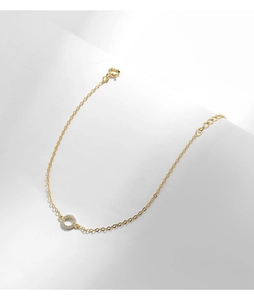 Close-up of gold S925 silver bracelet featuring a micro-set zircon hollow circle charm