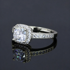 Luxurious white gold plated ring with cushion cut moissanite and halo diamond setting