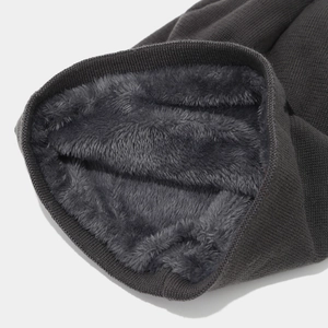 Winter knit beanie with star pattern and thick warm fleece lining in dark grey