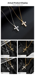 Detail view of cross necklaces with pearl inlay and CZ stones on black leather background