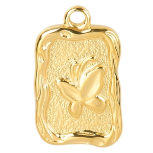 Macro detail of gold butterfly rectangular pendant with textured wavy border and metallic finish