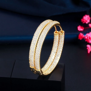 Detailed macro view of 18K gold-plated hoop earrings with pave-set zircon crystals
